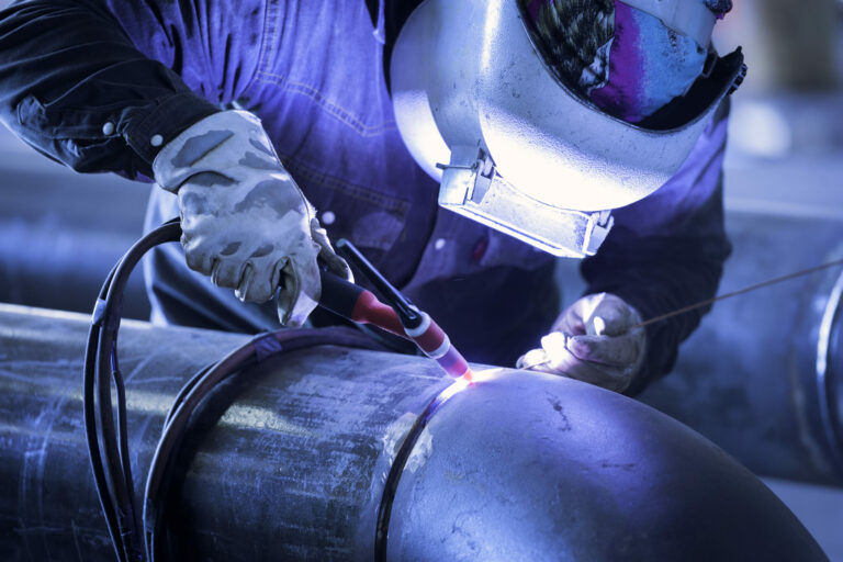 Worker,Welding,Metal,Piping,Using,Tig,Welder/he,Work,In,A Worker,Welding,Metal,Piping,Using,Tig,Welder/he,Work,In,A