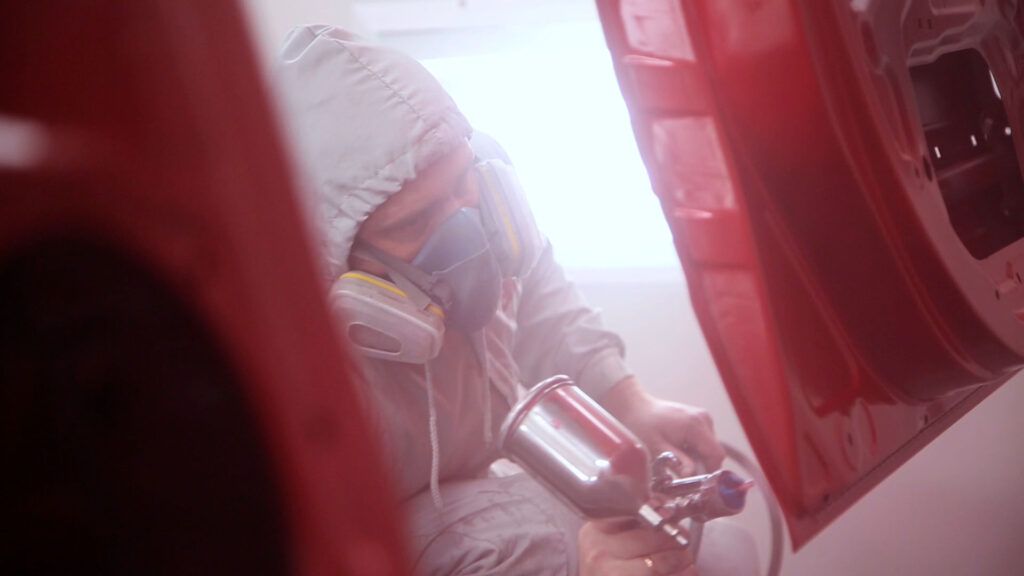 shutterstock_21579829.mov.00_06_02_06 Spray Painting man red car