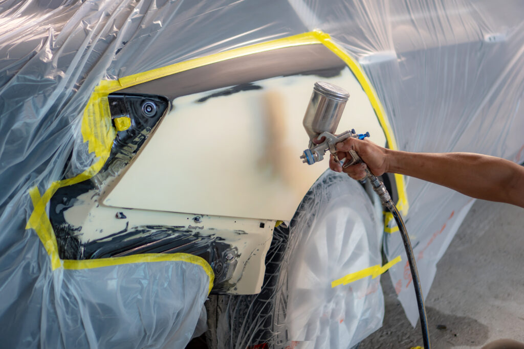 Repairing,Car,Body,By,Puttying,Close,Up,Work,After,The HVLP spray gun technology