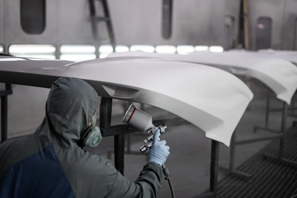 Worker spray painting